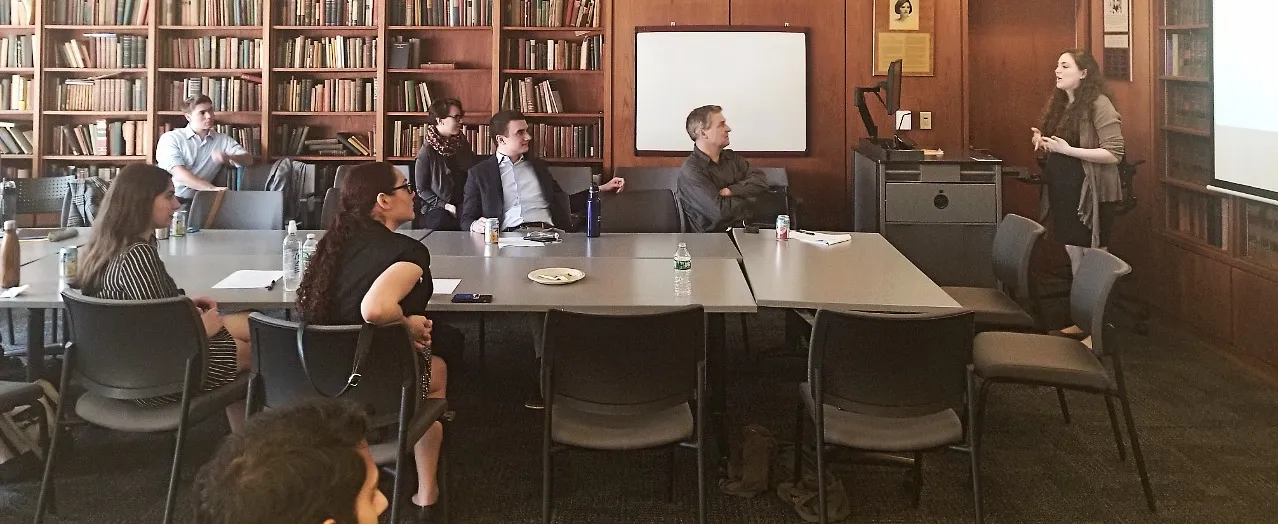 Undergraduate student presenting honors thesis to seminar group